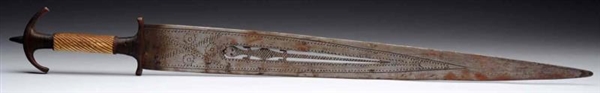 EARLY TRIBAL SWORD WITH LIZARD ORNAMENT.          
