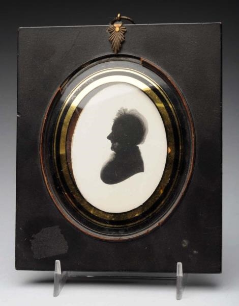 FRAMED PAINTED SILHOUETTE UNDER GLASS.            