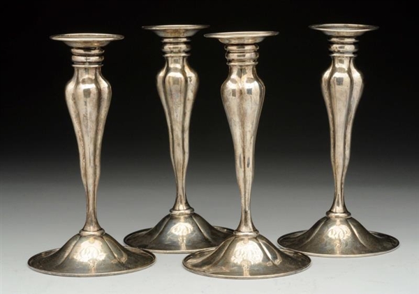 SET OF FOUR WHITING STERLING CANDLESTICKS.        