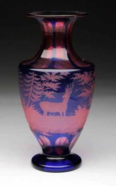ART GLASS VASE IN COBALT BLUE WITH PINK GLASS.    