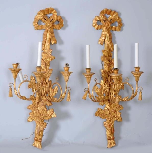 PAIR OF CARVED GILT IRON ELECTRIC SCONCES.        