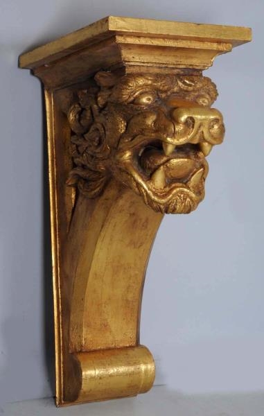 CARVED GILT WOODEN LIONS HEAD WALL BRACKET.       