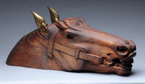 CARVED WOODEN HORSE HEAD WITH BRONZE EARS.        