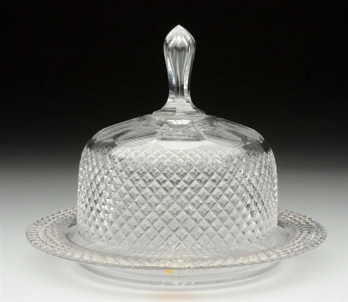 CUT GLASS CRYSTAL DOME SET ON PLATE.              