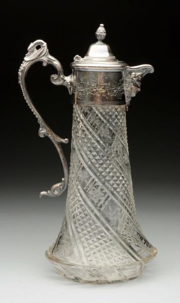 A SILVER PLATE-MOUNTED CLARET JUG.                