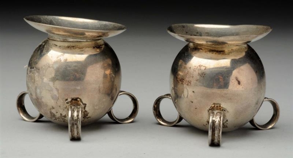 PAIR OF MEXICAN STERLING CANDLE HOLDERS.          