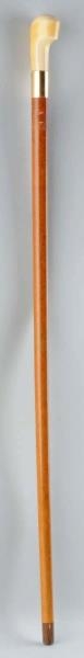 IVORY AND 18K GOLD HANDLED WALKING STICK.         