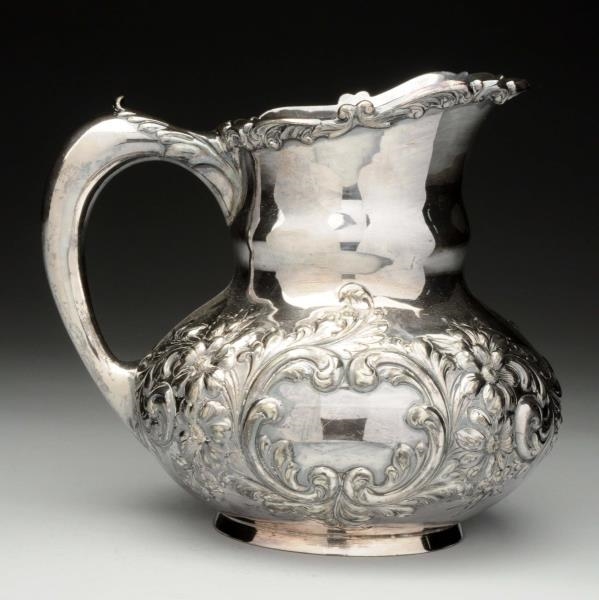 A SILVER PLATED WATER PITCHER.                    