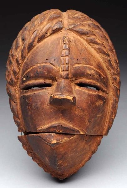 EARLY WOODEN TRIBAL MASK.                         
