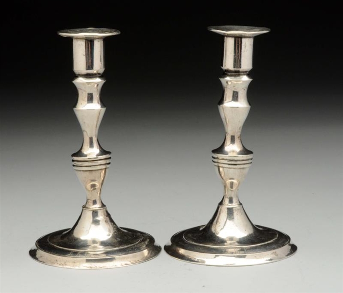 PAIR OF SMALL SILVER CANDLESTICKS.                