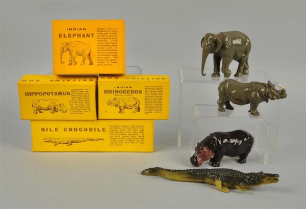 LOT OF 4: METAL ANIMAL FIGURINES IN BOXES.        