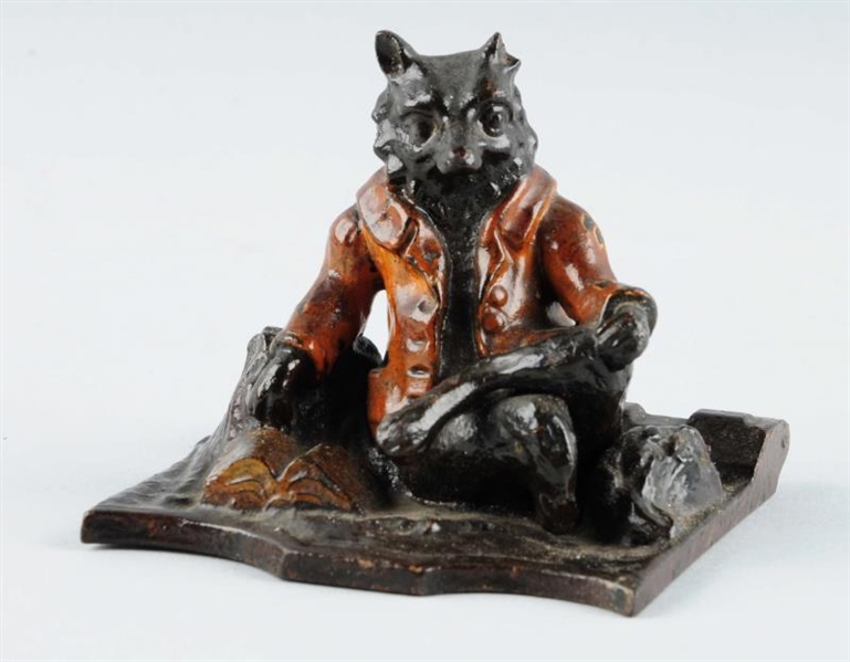 CAST IRON RESTING CAT WEARING JACKET PAPERWEIGHT. 