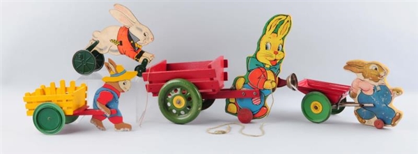 LOT OF 4: WOODEN EASTER RABBITS WITH CARTS.       