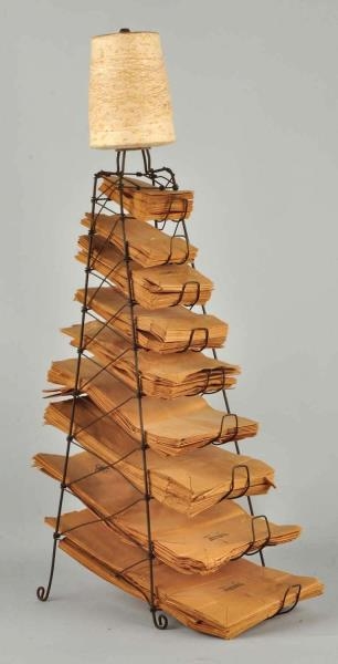 EARLY COUNTRY STORE PAPER BAG RACK.               