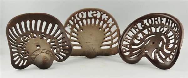 LOT OF 3: CAST IRON TRACTOR SEATS.                