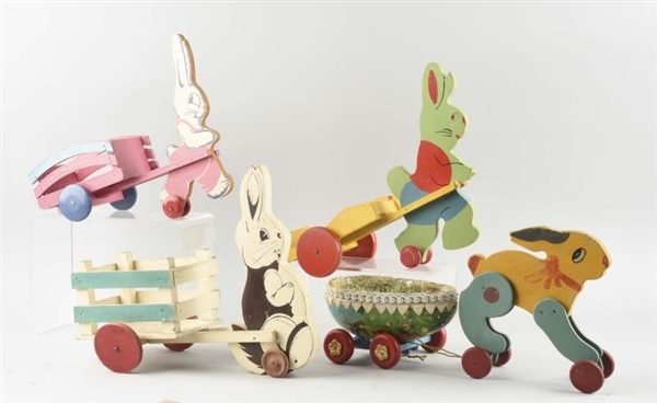 LOT OF 4: WOODEN RABBIT WITH WAGONS.              