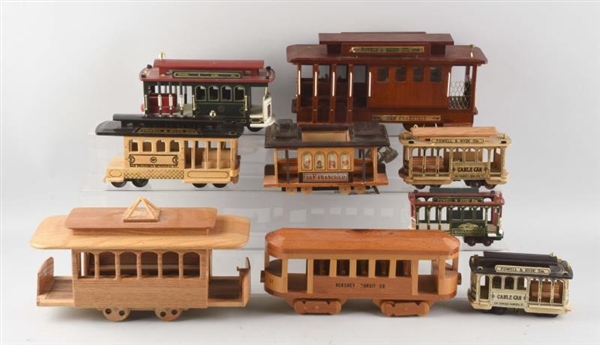 LARGE BOX OF ASSORTED WOODEN TROLLEYS.            