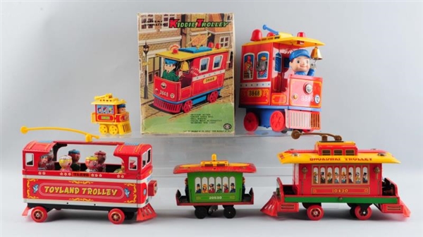 LOT OF 5: BATTERY & FRICTION TOY TROLLEY CARS.    