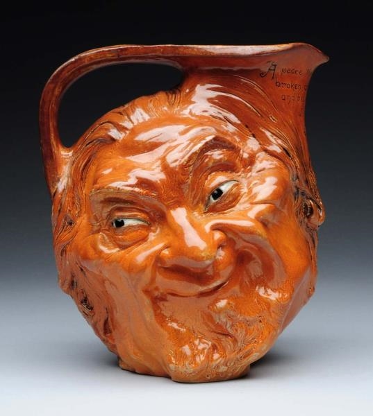 MARTIN BROTHERS STONEWARE DOUBLE SIDED FACE JUG.  