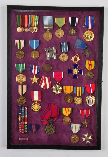 LOT OF 37: MILITARY BADGES AND RIBBONS.           