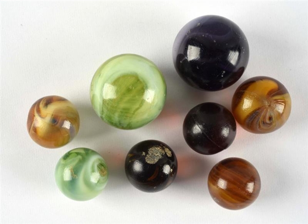 LOT OF 8: BULLET MOLD MARBLES.                    