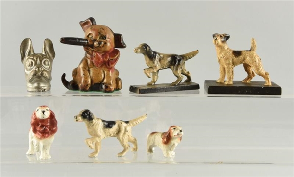 LOT OF 7: CAST IRON ASSORTED DOG PAPERWEIGHTS.    