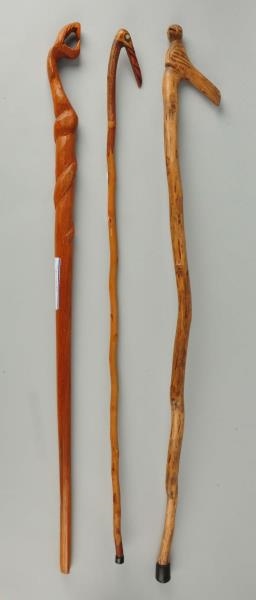 LOT OF 3: WOODEN CANES OR WALKING STICKS.         