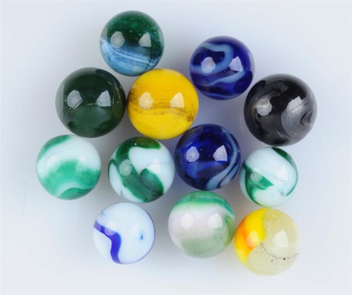 LOT OF 12: MACHINE MADE MARBLES.                  