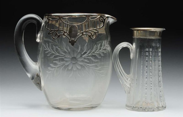 LOT OF 2: GLASS PITCHERS WITH SILVER OVERLAY.     