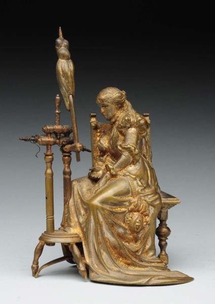 MINIATURE BRONZE OF LADY AT A SPINNING WHEEL.     