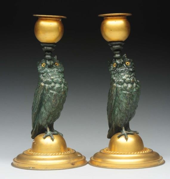 PAIR OF BRASS FIGURAL OWL CANDLE STICK HOLDERS.   