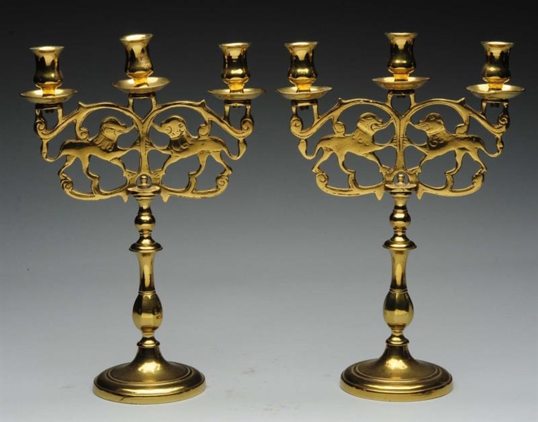 LOT OF 2: BRASS CANDLESTICKS WITH DOGS.           
