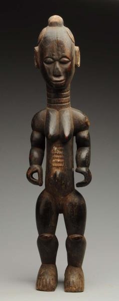 CARVED WOODEN AFRICAN TRIBAL FIGURE.              