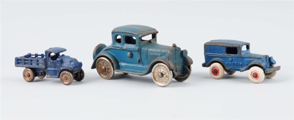 LOT OF 3: SMALL BLUE CAST IRON VEHICLES.          