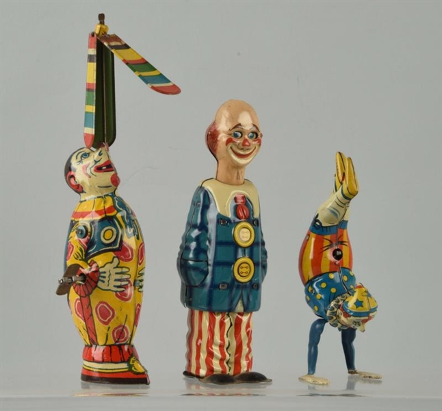 LOT OF 3:GERMAN & AMERICAN TIN WIND-UP CLOWN TOYS.