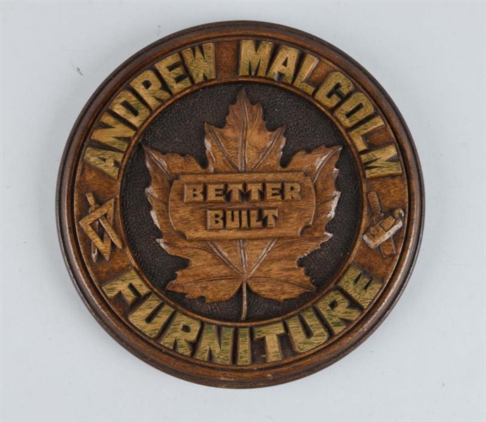 ANDREW MALCOLM FURNITURE CARVED WOODEN SIGN.      