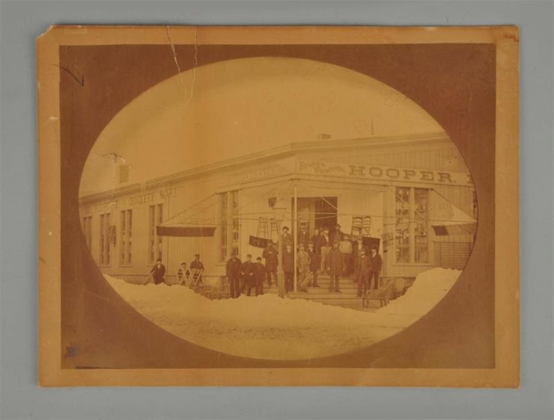 LARGE CABINET CARD PHOTO OF STOREFRONT.           