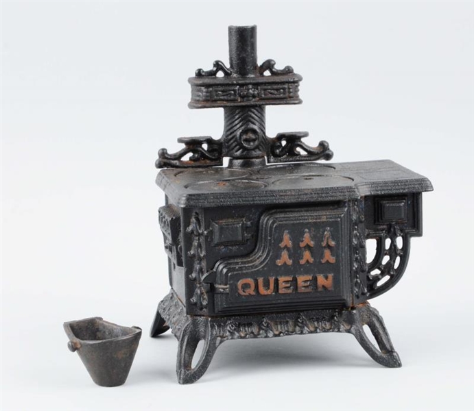 CAST IRON QUEEN TOY STOVE.                        