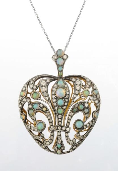AN OPAL AND DIAMOND PENDANT NECKLACE.             