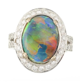 A BLACK OPAL AND DIAMOND RING.                    