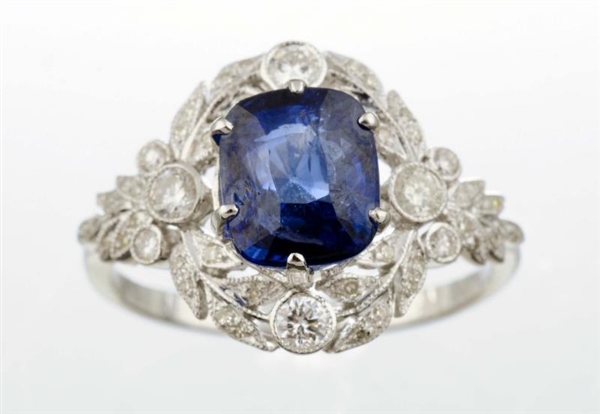 A DIAMOND AND SAPPHIRE RING.                      