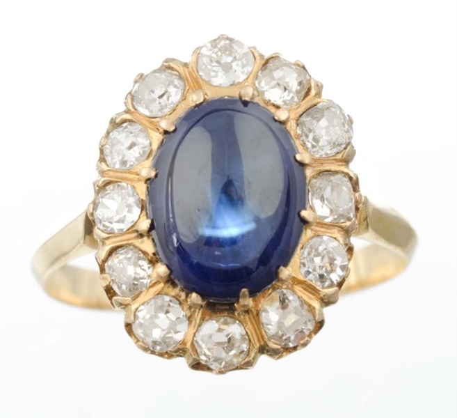 A SAPPHIRE AND DIAMOND RING.                      