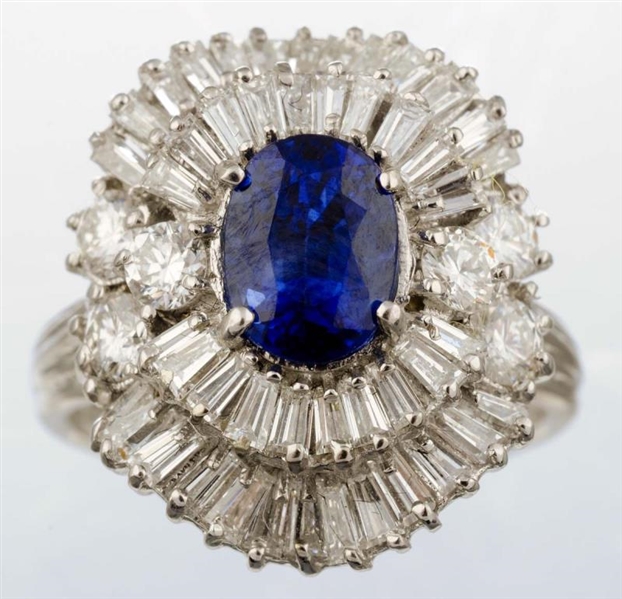 A DIAMOND AND SAPPHIRE RING.                      
