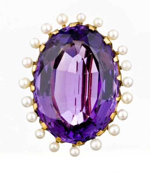 AN AMETHYST AND SEED PEARL BROOCH.                