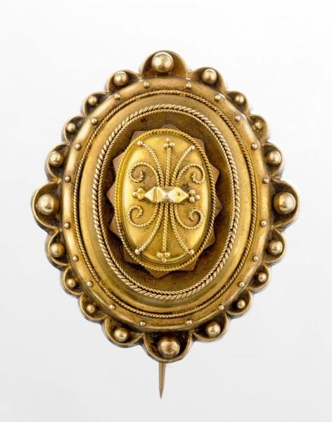 A VICTORIAN GOLD MOURNING BROOCH.                 