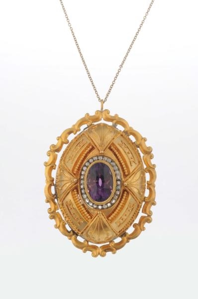 AN AMETHYST AND DIAMOND PENDANT NECKLACE.         