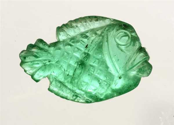 AN UNMOUNTED CARVED COLOMBIAN EMERALD.            