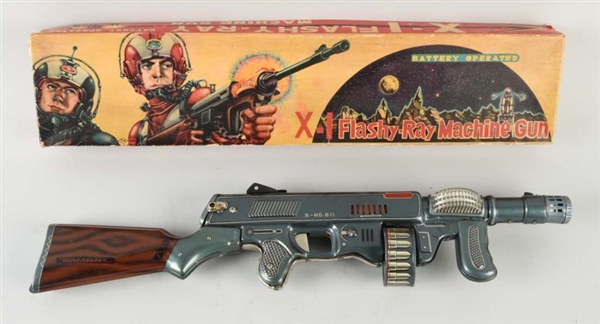 JAPANESE TIN LITHO FLASHY RAY MACHINE GUN.        