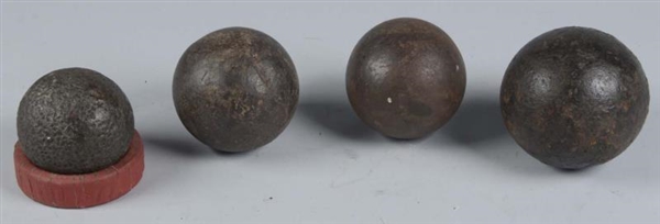 LOT OF 4: EXCAVATED CANNON BALLS.                 
