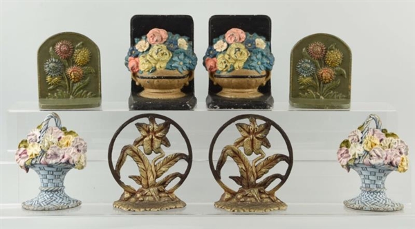 LOT OF 4: PAIRS OF CAST IRON FLOWER BOOKENDS.     